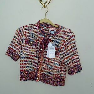 Knitted top that can be worn with an undershirt or without. Pearls super pretty!